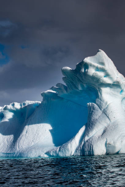 istock Weather eroded iceberg in Wilhemina Bay Antarctica 996105312