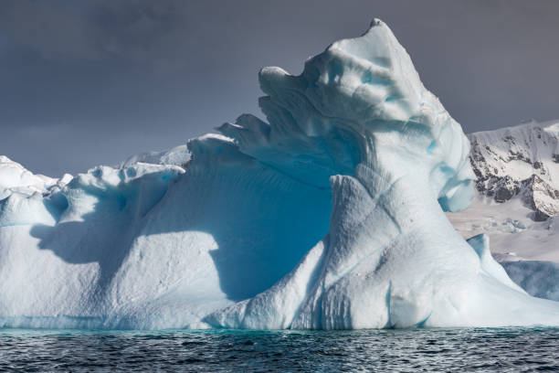 istock Weather eroded iceberg in Wilhemina Bay Antarctica 996105722