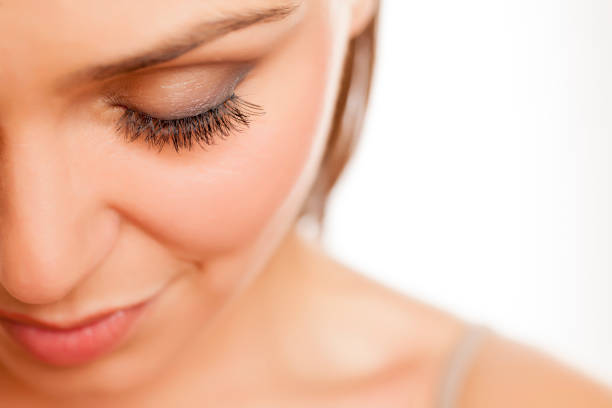 istock close up of female eye with false eyelashes on white background 996105986