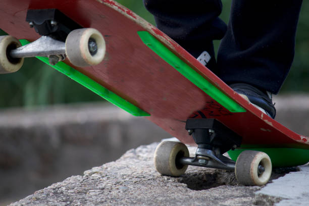 istock A teenager is standing on a skateboard. 996106314