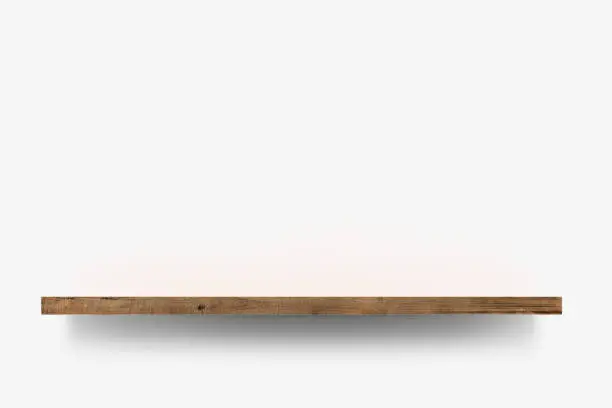 Wooden shelf over white background background