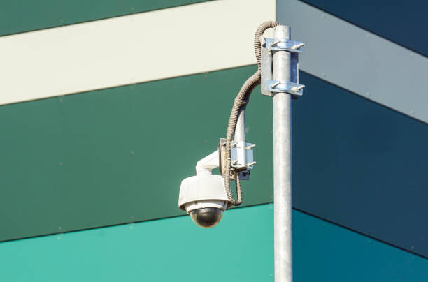 istock video camera security system on the wall of the building 996119414