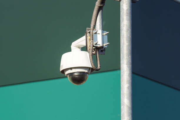 istock video camera security system on the wall of the building 996119730