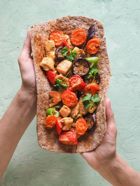 istock Tortilla with vegetables and grilled meat. 996123138