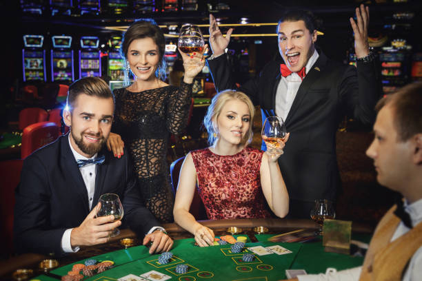 istock Happy and rich people celebrating successful game 996132190