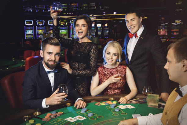 istock Happy and rich people celebrating successful game 996132282