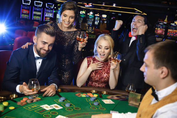 istock Happy and rich people celebrating successful game 996132436