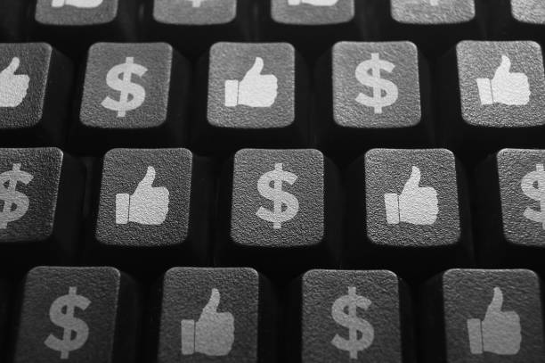 Making money with social media, money icon and like button on computer keyboard