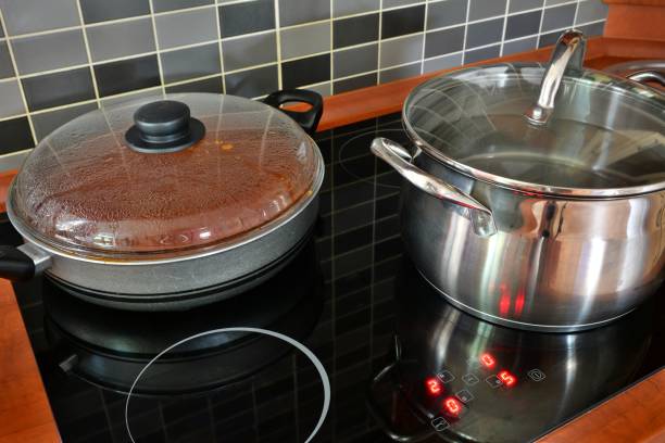 istock Pot and pan on kitchen induction stove 996150180