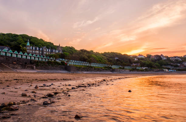 Sunrise at Langland Bay, Gower Peninsula Sunrise at Langland Bay, Gower Peninsula, Swansea gower peninsular stock pictures, royalty-free photos & images