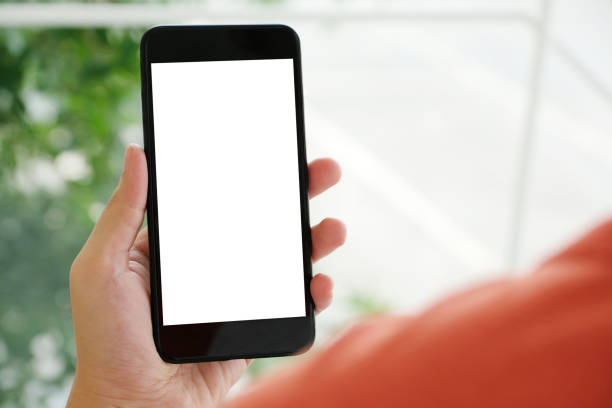 istock Man hand holding black smart phone with blank screen on background for mock up, template, technology and lifestyle 996158792
