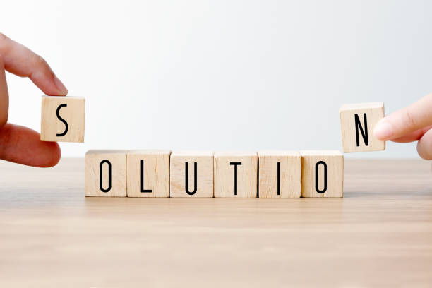 istock Hand holding wooden cubes with solution word, business concept background, mock up, template 996160404