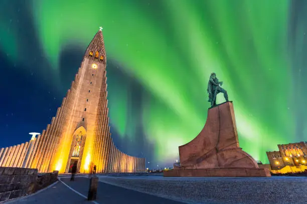 aurora borealis above hallgrimskirkja church in central of reykjavik city in Iceland