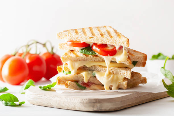 istock grilled cheese and tomato sandwich on white background 996167590