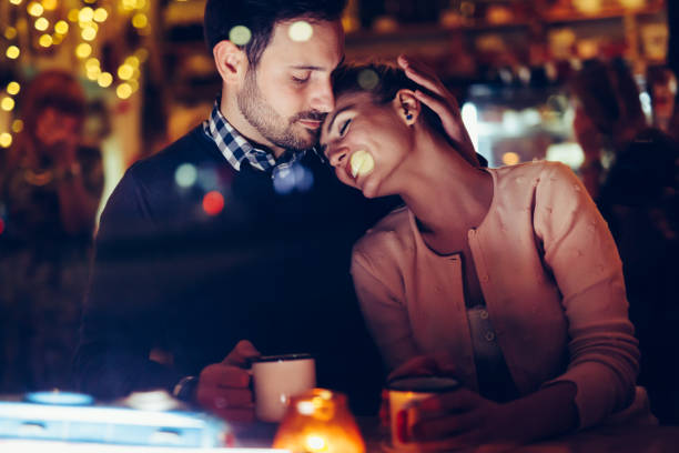 istock Romantic couple dating in pub at night 996167868
