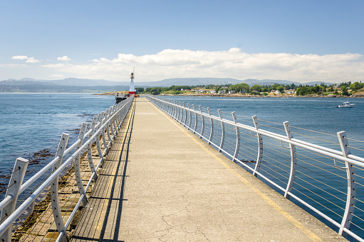 Photo of a Breakwater at the -Entrance of a Harbour on a Sunny Day. Victoria, BC, Canada.