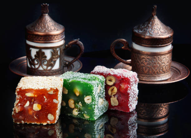 istock Multicolored rahat lukum on the table, followed by cups with fragrant Turkish coffee 996171142