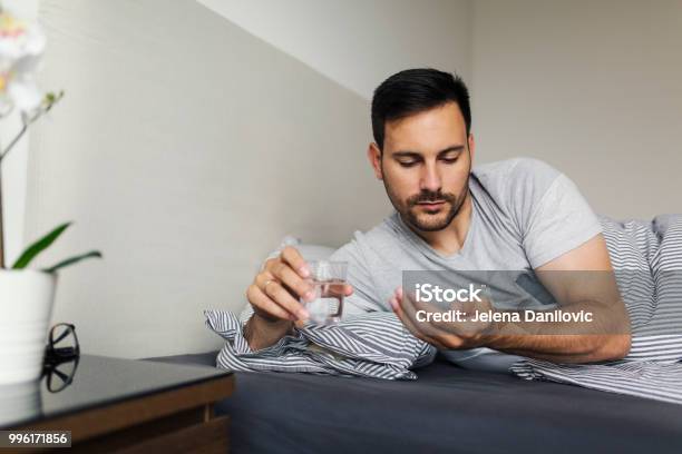 Taking Pills Stock Photo - Download Image Now - Taking Medicine, Men, Sleeping