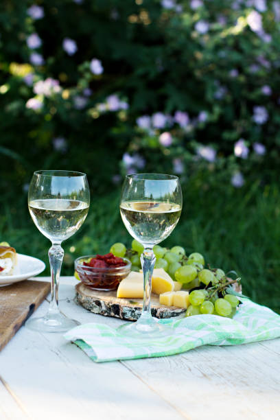 istock White wine and light snacks, Grapes, wine, cheese, pie. 996172846