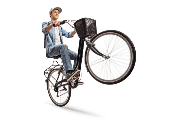 istock Teenager doing a wheelie with a bicycle 996178836