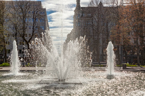 istock Backlit fountain by Karl Johan main street in spring. 996179296