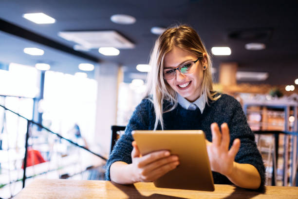 istock Portrait of young attractive woman using tablet 996181998