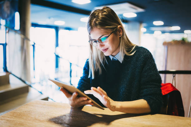 istock Portrait of young attractive woman using tablet 996182052