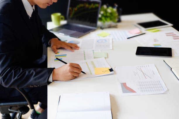 istock Businessman analyzing investment fund charts with laptop. Accounting 996182842
