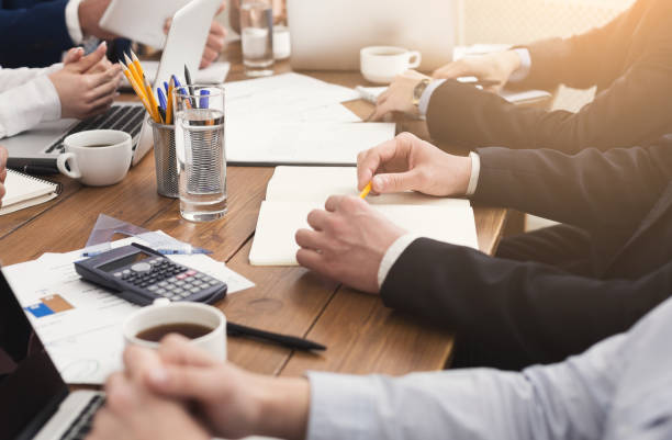 istock Business people sitting together and making notes 996183550