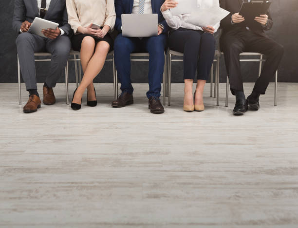 istock Group of business people sitting with gadgets 996184488