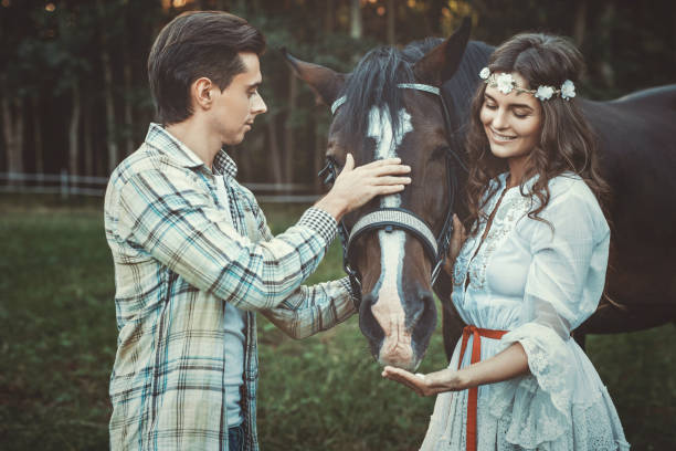 istock Young couple and beautiful horse 996221734