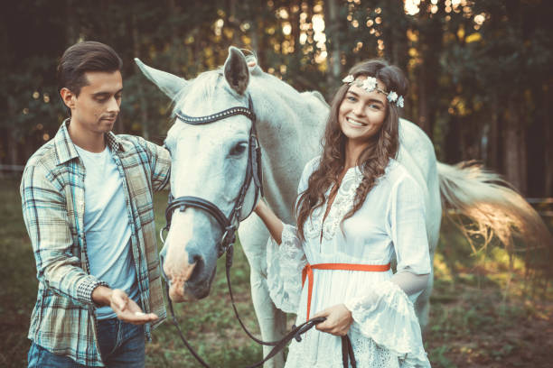 istock Young couple and beautiful horse 996221898
