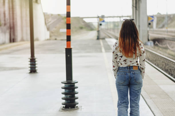 istock Lady waiting at the railway station 996224478