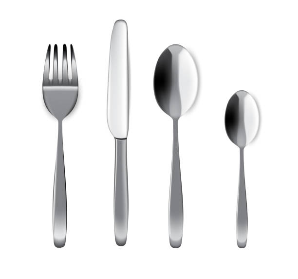 istock Mock up Realistic Metal Spoon, Fork And Knife on Dining Table for food isolated Background. 996225816