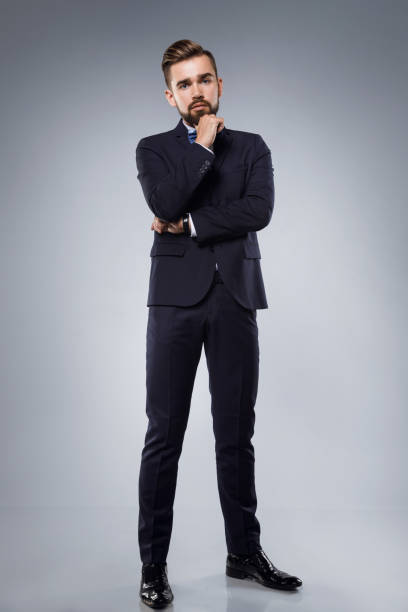 istock Stylish handsome man wearing a classic suit with bow-tie 996231666