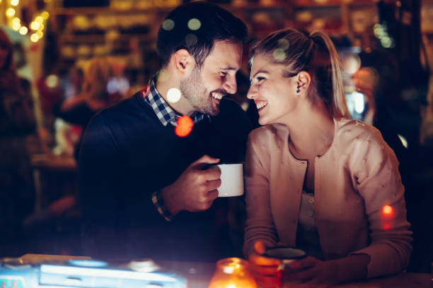 istock Romantic couple dating in pub at night 996232232