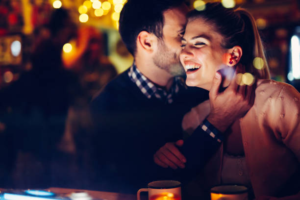 istock Romantic couple dating in pub at night 996232524