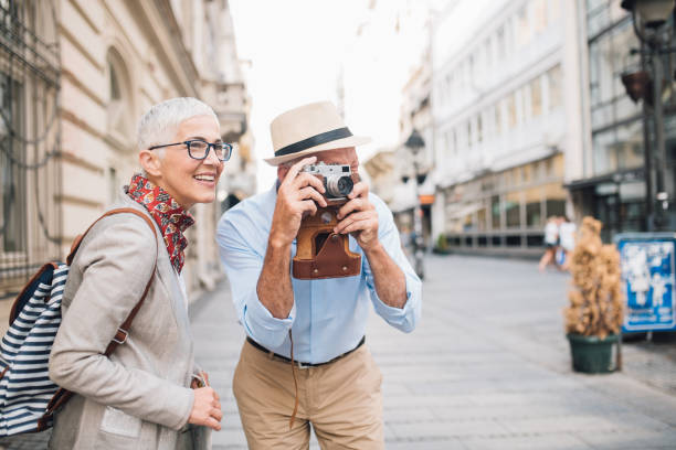 istock Joyful mature woman by husband using photographic equipment 996237906