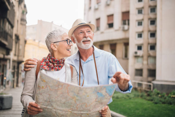 istock Happy couple looking for direction on their vacation 996238094