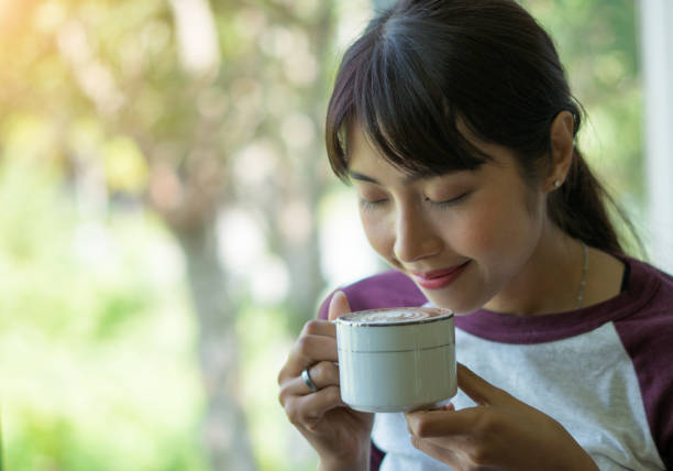 istock woman in a cafe drinking coffee 996238194