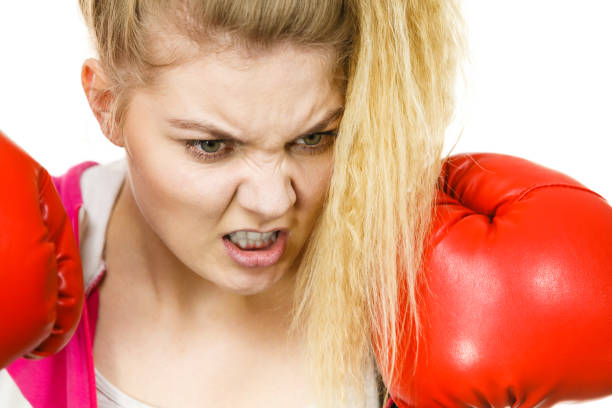 istock Woman wearing boxing gloves 996238222