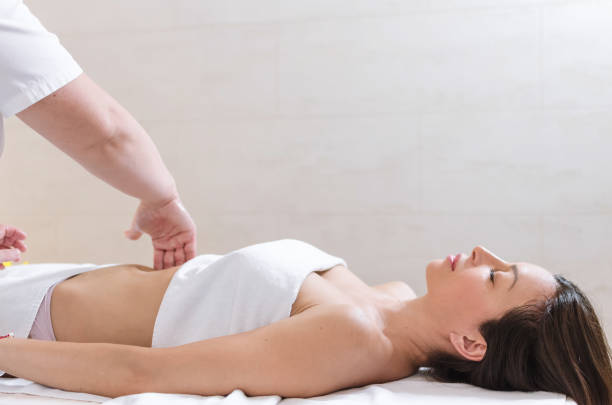 istock Woman getting stomach massage 996238766