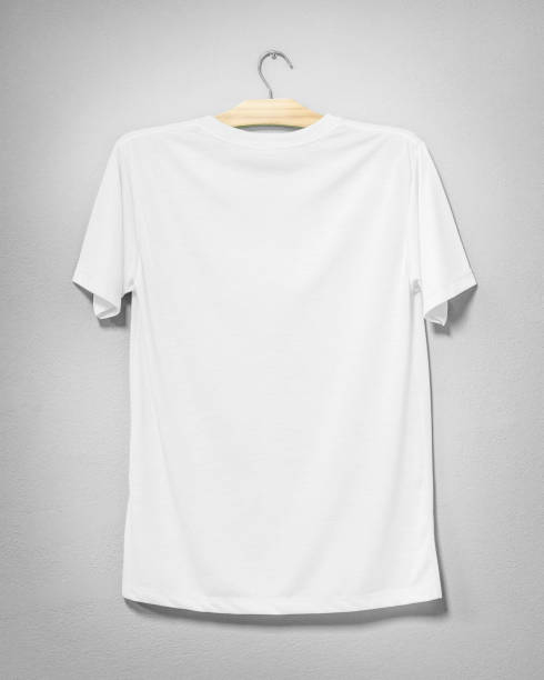 istock White shirt hanging on cement wall. Empty clothing for design. Back view. 996245098