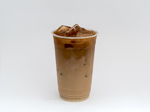 Cold Brew Iced Coffee in a clear cup on a white background with sweet cream.