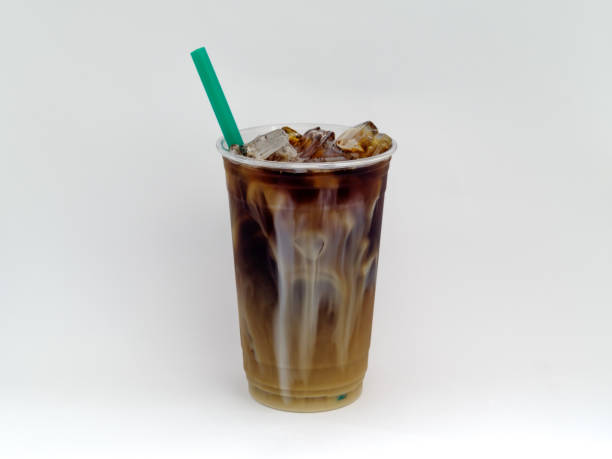 istock Cold Brew Iced Coffee in a clear cup on a white background with sweet cream. 996249386