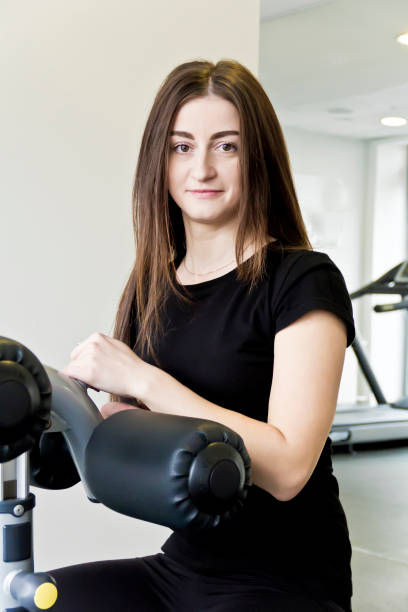istock Brunette with long hair to train in gym 996250156