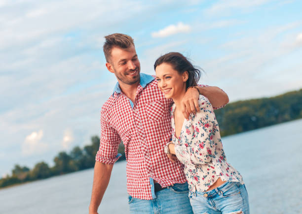 istock Happy young couple enjoying spending time together on the beach. 996251486