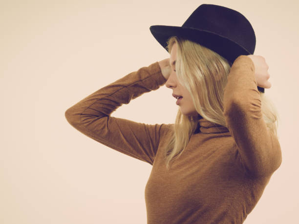 istock Woman wearing suede and black hat 996257188