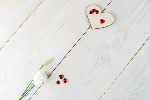 istock layout copy space for text wooden background with flowers, heart 996257342