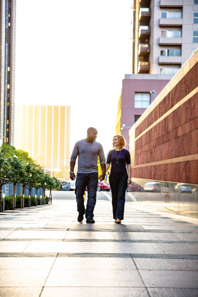 istock LA Couple Holding Hands in Downtown at Sunset 996260680